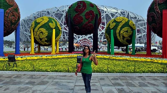 Manali striking a pose in front of The Bird's Nest (National Stadium) in Beijing.